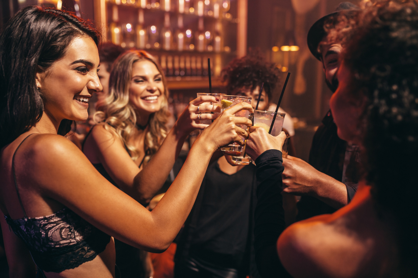 Young People with Cocktails at Nightclub